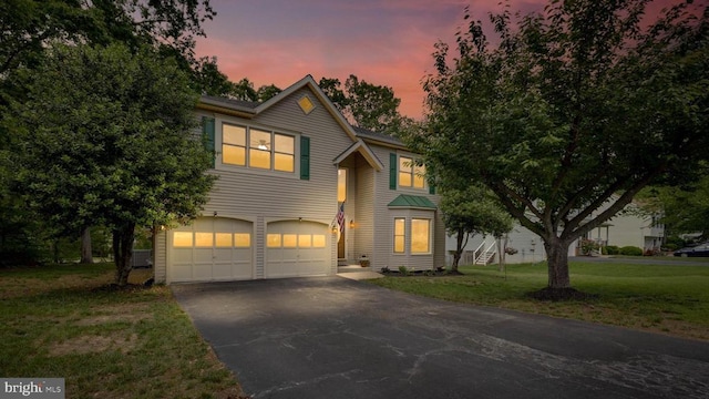 4209 Oakhill Rd, Fredericksburg, VA 22408 - traditional-style house featuring a garage, driveway, and a front lawn