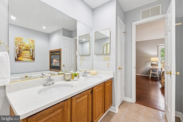 4209 Oakhill Rd, Fredericksburg, VA 22408 - full bathroom with double vanity and tile patterned floors