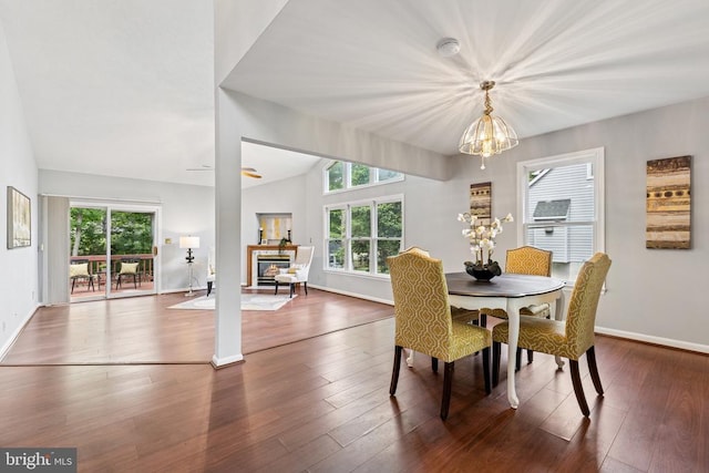4209 Oakhill Rd, Fredericksburg, VA 22408 - dining room featuring a chandelier, vaulted ceiling, and wood finished floors