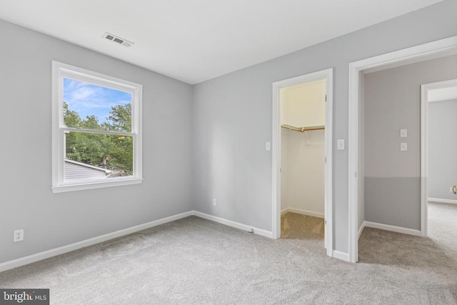 4209 Oakhill Rd, Fredericksburg, VA 22408 - unfurnished bedroom featuring carpet, a spacious closet, and a closet