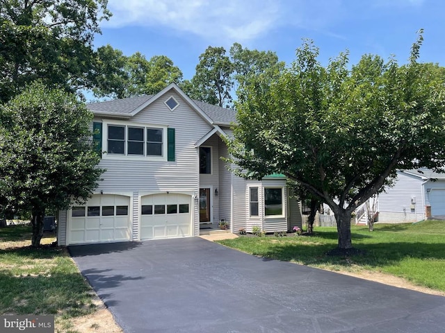 4209 Oakhill Rd, Fredericksburg, VA 22408 - view of front facade with an attached garage, driveway, a front yard, and a shingled roof