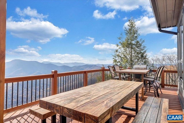 wooden deck with a mountain view