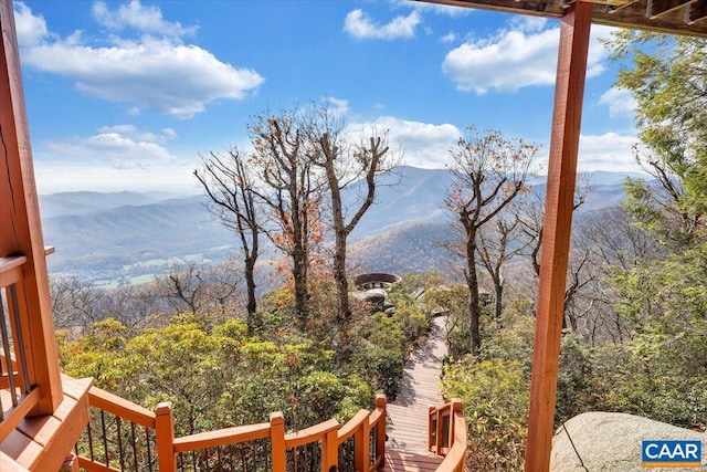 wooden deck featuring a mountain view