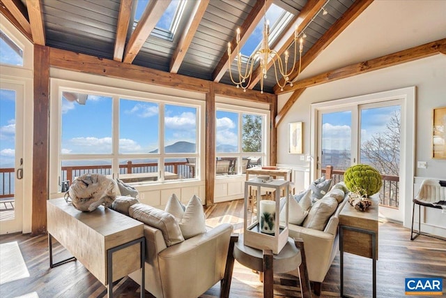 sunroom / solarium featuring wood ceiling and lofted ceiling with skylight