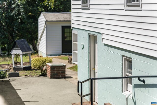 property entrance with a patio area