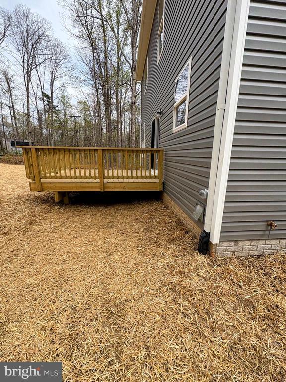 view of property exterior featuring a deck