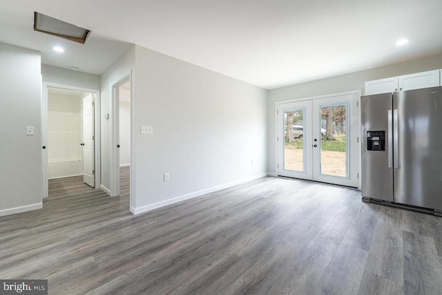 1087 Judy Ln, Stanley, VA 22851 - unfurnished living room with attic access, wood finished floors, french doors, baseboards, and recessed lighting