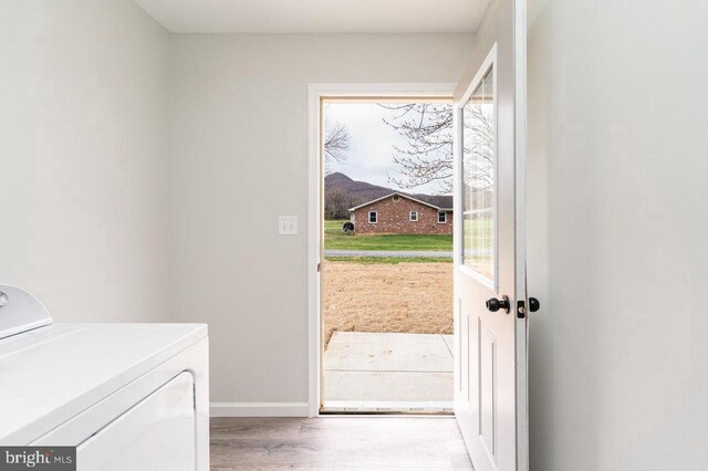 1087 Judy Ln, Stanley, VA 22851 - clothes washing area with washer / dryer, wood finished floors, and baseboards