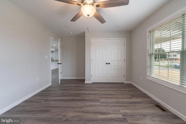 1087 Judy Ln, Stanley, VA 22851 - unfurnished bedroom with a closet, baseboards, dark wood-type flooring, ceiling fan, and recessed lighting