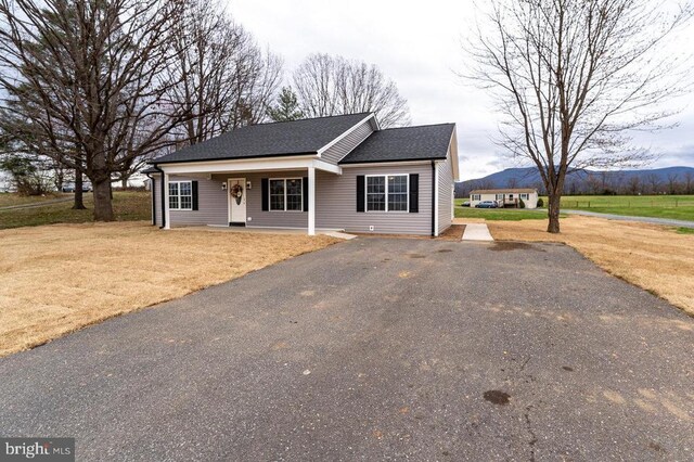 1087 Judy Ln, Stanley, VA 22851 - single story home featuring a shingled roof, a porch, driveway, and a front yard