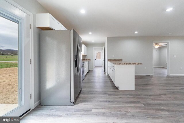 1087 Judy Ln, Stanley, VA 22851 - kitchen featuring stainless steel appliances, white cabinetry, baseboards, plenty of natural light, and recessed lighting