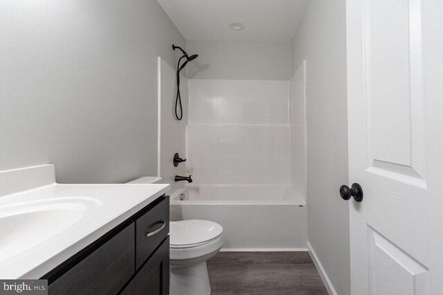1087 Judy Ln, Stanley, VA 22851 - bathroom with wood finished floors, toilet, vanity, tub / shower combination, and baseboards