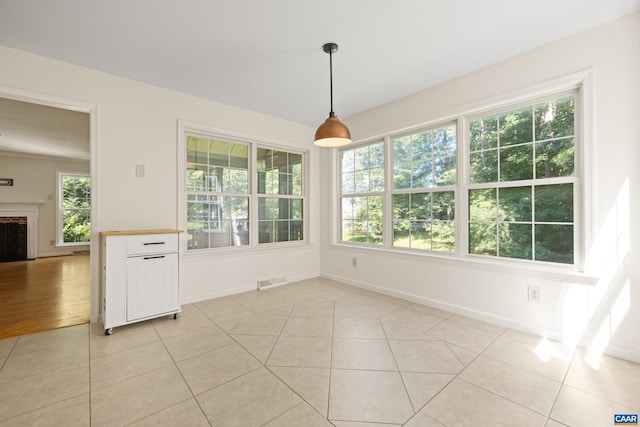 2777 Peppervine Ct, Charlottesville, VA 22911 - unfurnished dining area with a brick fireplace and light tile patterned floors