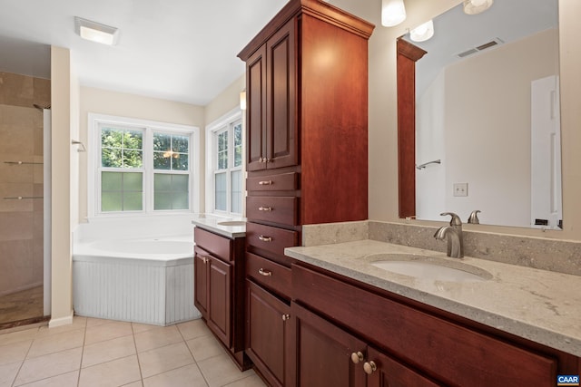 2777 Peppervine Ct, Charlottesville, VA 22911 - bathroom with vanity, a garden tub, tiled shower, and tile patterned flooring