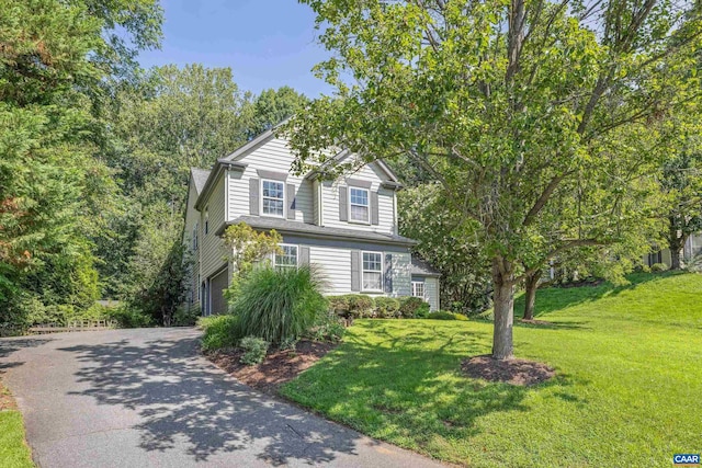2777 Peppervine Ct, Charlottesville, VA 22911 - view of front facade with asphalt driveway, a front lawn, and an attached garage