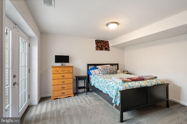 carpeted bedroom with baseboards