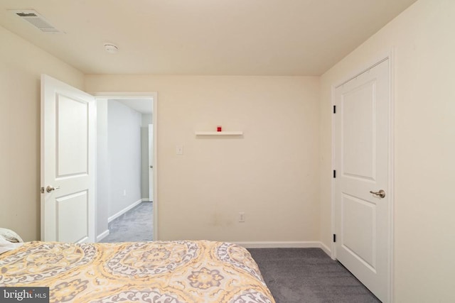 carpeted bedroom with baseboards