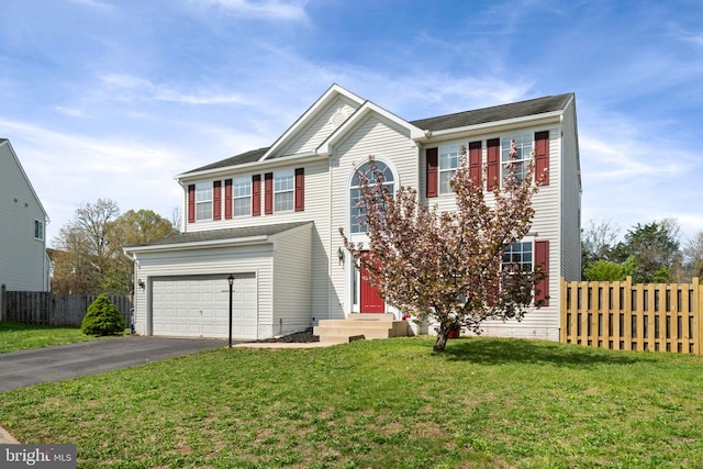 traditional home featuring driveway and an attached garage