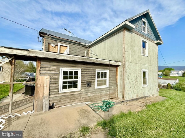 206 Masonic Dr, Stanley, VA 22851 - rear view of property with solar panels and a yard