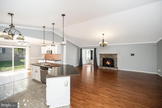 202 Yorktown Blvd, Locust Grove, VA 22508 - kitchen with stainless steel dishwasher, a chandelier, white cabinets, lofted ceiling, and a sink