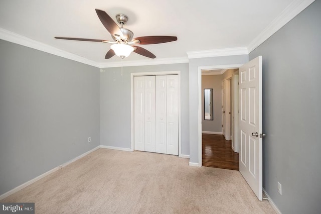 202 Yorktown Blvd, Locust Grove, VA 22508 - unfurnished bedroom featuring ornamental molding, carpet floors, a closet, baseboards, and a ceiling fan
