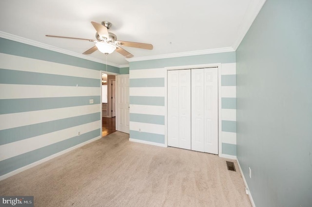 202 Yorktown Blvd, Locust Grove, VA 22508 - unfurnished bedroom with baseboards, carpet flooring, crown molding, a closet, and ceiling fan