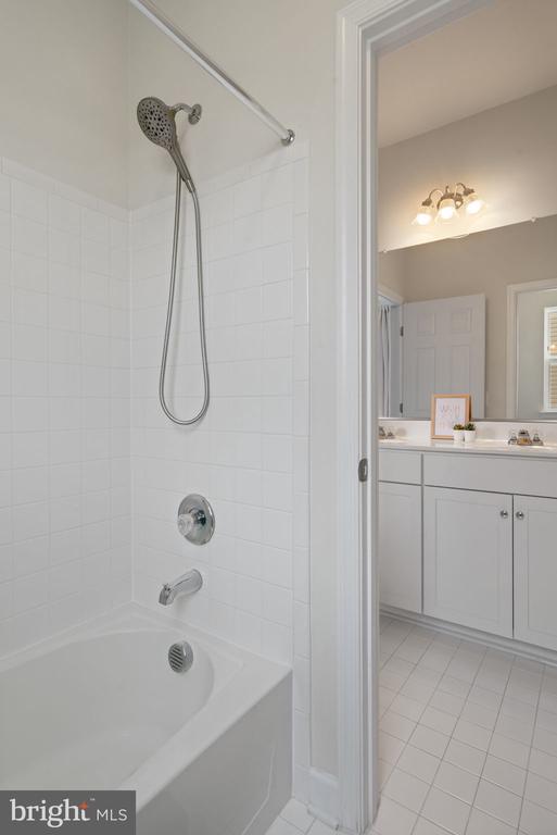 10430 Aspen Highlands Dr, Spotsylvania, VA 22553 - full bathroom featuring tile patterned floors, vanity, and bathtub / shower combination