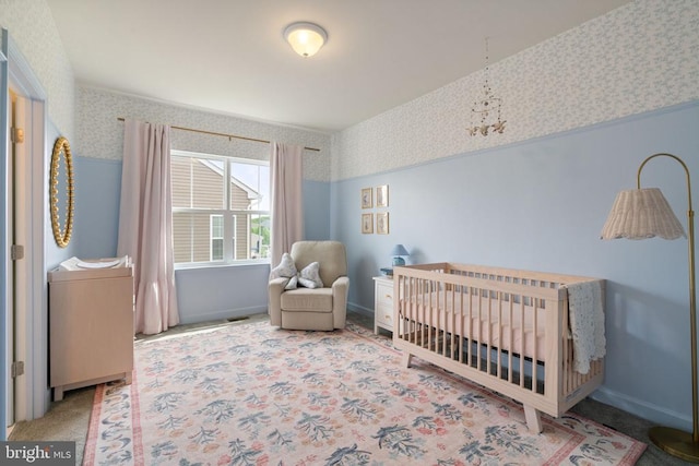 10430 Aspen Highlands Dr, Spotsylvania, VA 22553 - bedroom with wallpapered walls, carpet, a nursery area, and baseboards