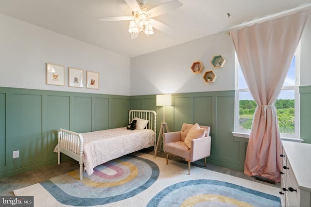 10430 Aspen Highlands Dr, Spotsylvania, VA 22553 - bedroom featuring a decorative wall, light colored carpet, a wainscoted wall, and ceiling fan