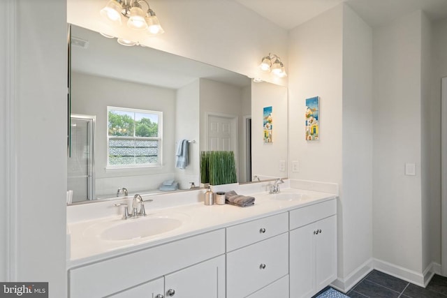 10430 Aspen Highlands Dr, Spotsylvania, VA 22553 - full bath with a stall shower, tile patterned floors, double vanity, and baseboards