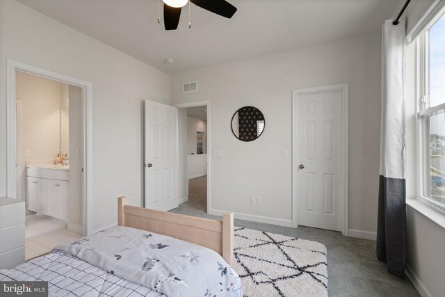 10430 Aspen Highlands Dr, Spotsylvania, VA 22553 - bedroom with baseboards, light colored carpet, ensuite bathroom, and ceiling fan
