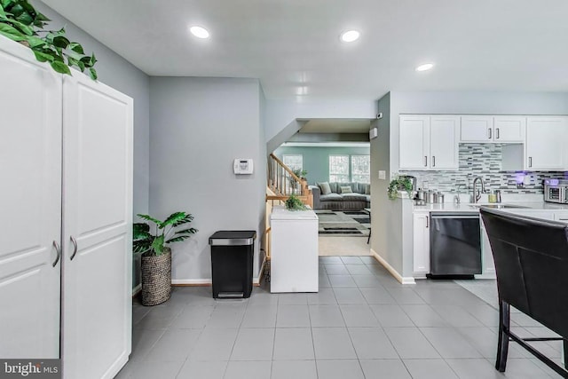 11222 Gander Ct, Fredericksburg, VA 22407 - kitchen featuring stainless steel dishwasher, light countertops, white cabinetry, decorative backsplash, and recessed lighting