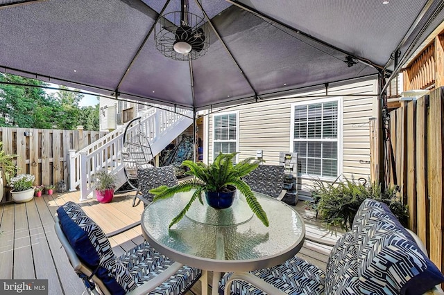 11222 Gander Ct, Fredericksburg, VA 22407 - deck featuring a gazebo, stairs, and outdoor dining space