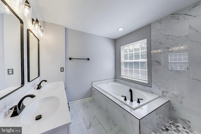 11222 Gander Ct, Fredericksburg, VA 22407 - full bath with marble finish flooring, a garden tub, double vanity, and recessed lighting