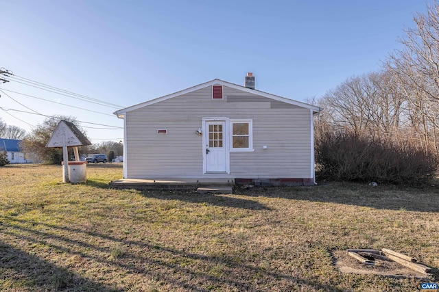 228 Old Fifteen Rd, New Canton, VA 23123 - back of house featuring a yard, a chimney, and crawl space