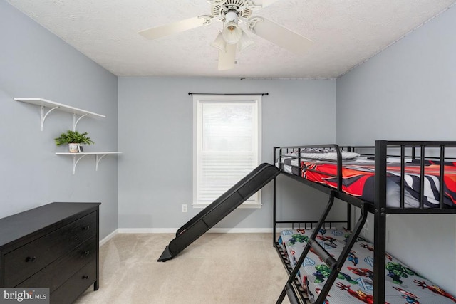 6701 Towles Mill Rd, Spotsylvania, VA 22551 - bedroom featuring carpet flooring, baseboards, a textured ceiling, and a ceiling fan