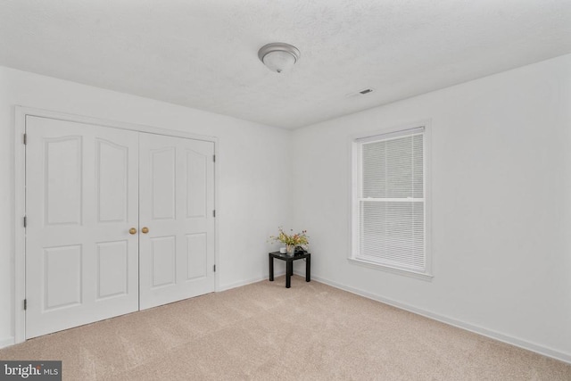 6701 Towles Mill Rd, Spotsylvania, VA 22551 - unfurnished bedroom with carpet floors, a closet, and baseboards