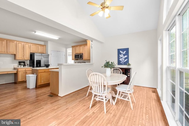 10911 Jarvis Ct, Fredericksburg, VA 22407 - dining space featuring light wood-type flooring, high vaulted ceiling, and ceiling fan