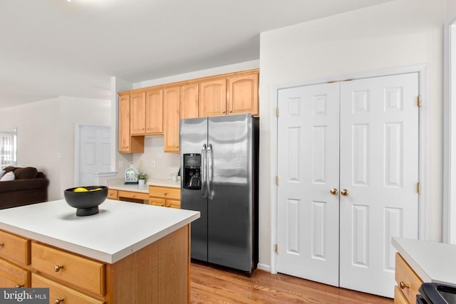 10911 Jarvis Ct, Fredericksburg, VA 22407 - kitchen with stainless steel fridge with ice dispenser, light countertops, light brown cabinets, light wood-style floors, and a kitchen island