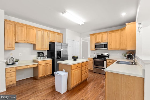 10911 Jarvis Ct, Fredericksburg, VA 22407 - kitchen with appliances with stainless steel finishes, light wood-style floors, built in study area, recessed lighting, and light countertops