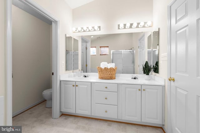 10911 Jarvis Ct, Fredericksburg, VA 22407 - bathroom featuring double vanity, a shower stall, and vaulted ceiling