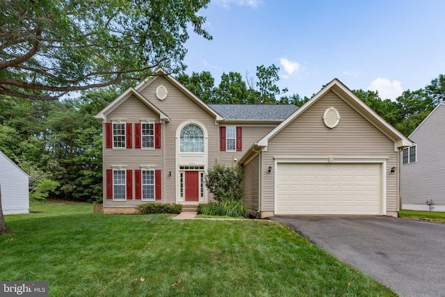 10911 Jarvis Ct, Fredericksburg, VA 22407 - view of front of home featuring asphalt driveway, a garage, and a front lawn