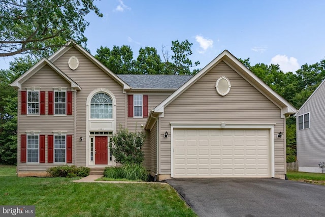 10911 Jarvis Ct, Fredericksburg, VA 22407 - colonial house featuring asphalt driveway, an attached garage, and a front lawn