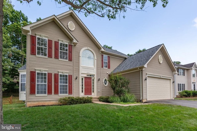 10911 Jarvis Ct, Fredericksburg, VA 22407 - colonial home featuring asphalt driveway and a garage