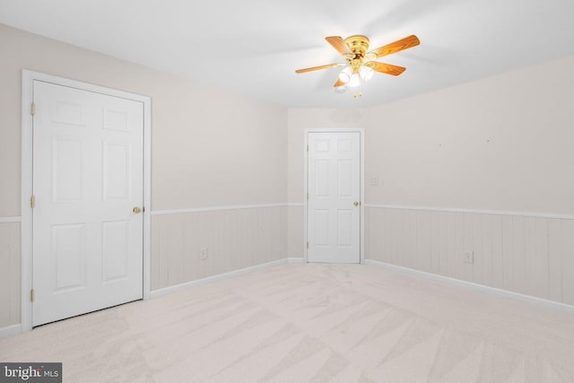 10911 Jarvis Ct, Fredericksburg, VA 22407 - unfurnished room with ceiling fan, carpet, a wainscoted wall, and wooden walls
