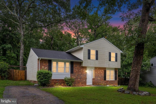6908 Wild Turkey Dr, Spotsylvania, VA 22553 - tri-level home featuring brick siding and a shingled roof