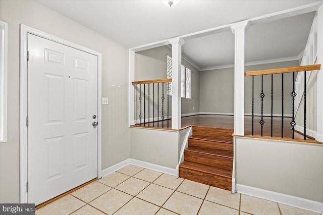 6908 Wild Turkey Dr, Spotsylvania, VA 22553 - entrance foyer with tile patterned flooring, ornamental molding, ornate columns, and stairs