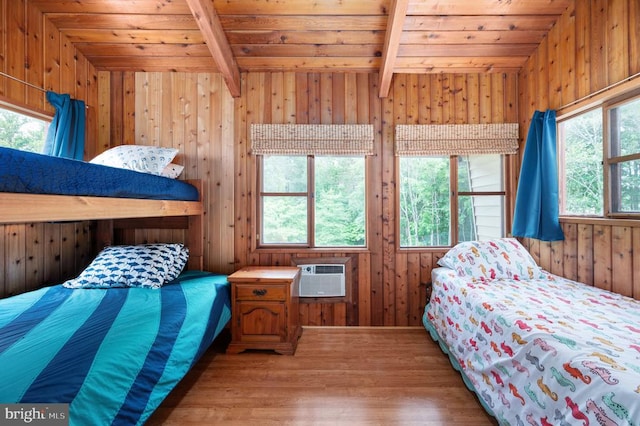 3477 Elk Creek Rd, Mineral, VA 23117 - bedroom featuring wooden ceiling, beam ceiling, a wall unit AC, wood finished floors, and wood walls