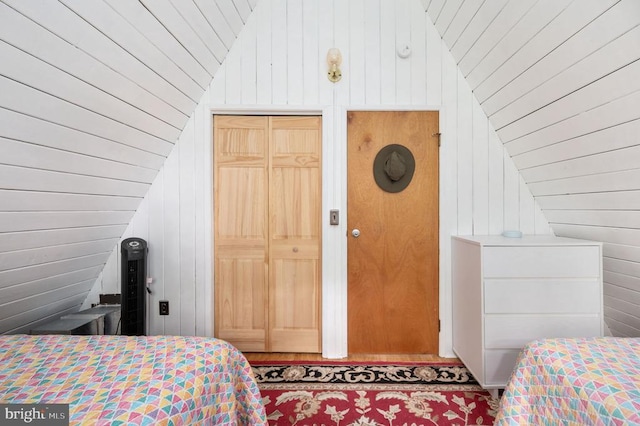 3477 Elk Creek Rd, Mineral, VA 23117 - bedroom with vaulted ceiling, wooden walls, wooden ceiling, wood finished floors, and a closet