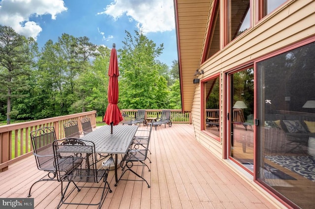 3477 Elk Creek Rd, Mineral, VA 23117 - wooden deck with outdoor dining space and view of scattered trees